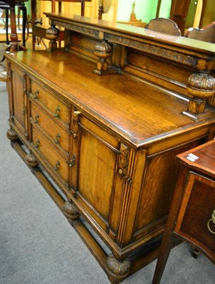 Lot 1345 - A late 19th/early 20th century carved oak sideboard