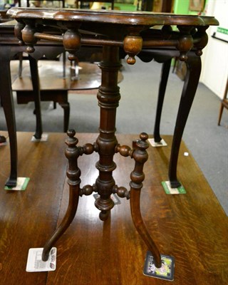 Lot 1349 - A 19th century walnut tripod table