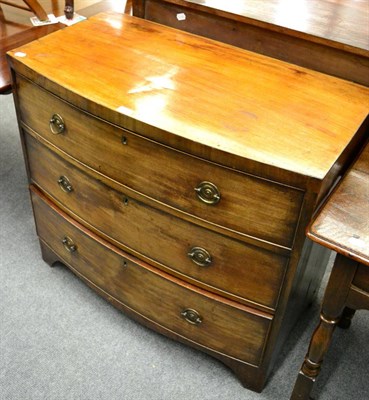 Lot 1353 - A bow fronted mahogany three height chest of drawers