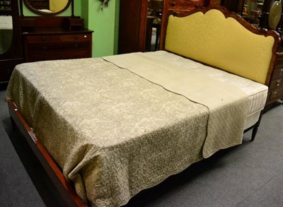 Lot 1361 - A rosewood and satinwood double bed with serpentine upholstered headboard and bed spread