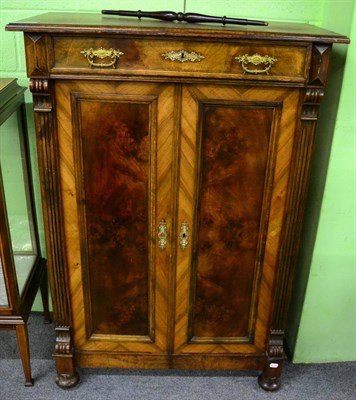 Lot 1370 - A 19th century French walnut cabinet with single drawer above cupboard