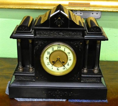 Lot 1375 - A slate mantel clock of architectural form