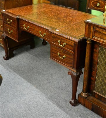 Lot 1380 - A mahogany inverted breakfront desk