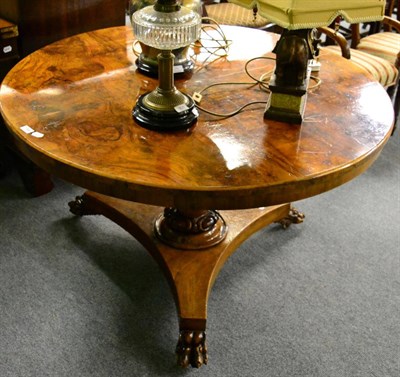 Lot 1384 - A 19th century walnut veneered circular table raised on a tapering cylindrical standard and a...