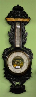 Lot 1388 - A carved oak barometer, Owen Robinson Ltd, Leeds (a.f.) and six various framed articles...