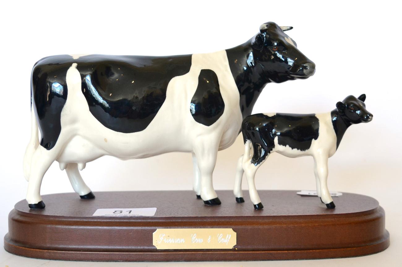 Lot 81 - Beswick Friesian Cow and Calf, model No. 1362/1249C, on wooden plinth, black and white gloss