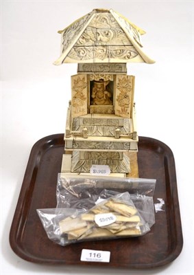 Lot 116 - A 19th century ivory pagoda, carved with birds, foliage and figures, the doors opening to...