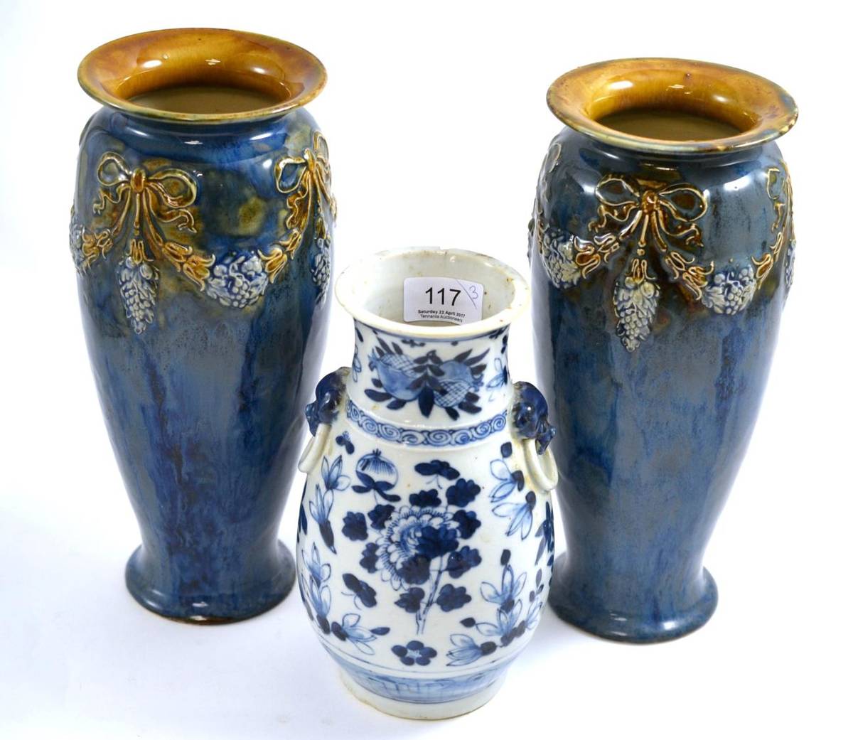 Lot 117 - A pair of Royal Doulton stoneware vases and a Japanese blue and white vase (3)