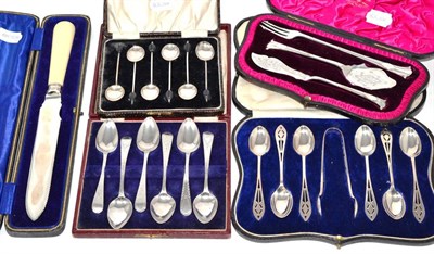 Lot 121 - A collection of various cased silver sets including an Edwardian silver-bladed bread knife,...