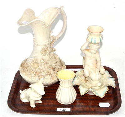Lot 148 - Four pieces of Belleek porcelain including a jug, chamberstick, vase and dog