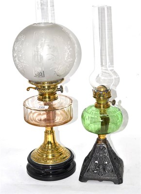 Lot 149 - Two Victorian oil lamps, one with clear glass reservoir, the other with green glass reservoir