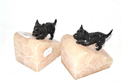 Lot 152 - Pair of cold painted bronze terriers mounted on alabaster bookends, together with a similar...