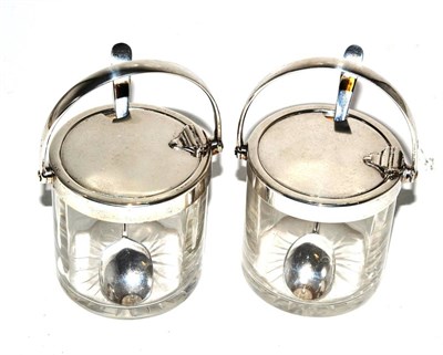 Lot 173 - A pair of silver mounted conserve jars and spoons