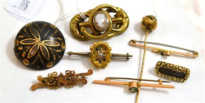 Lot 213 - A tortoiseshell pique work brooch (a.f.), a cameo knot brooch, a seed pearl and enamel brooch,...