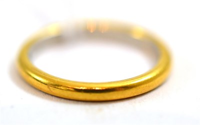 Lot 220 - A band ring stamped '22CT'