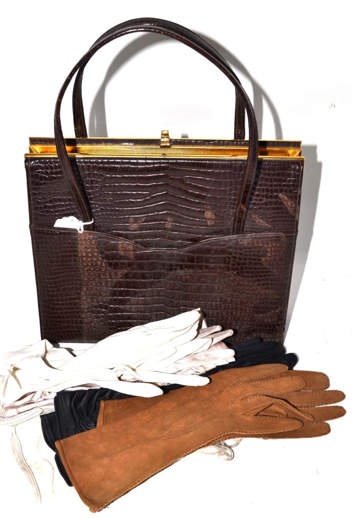 Lot 264 - An alligator handbag, five pairs of gloves including kid examples
