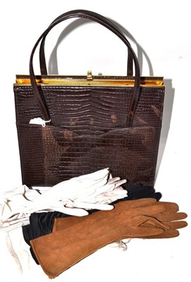 Lot 264 - An alligator handbag, five pairs of gloves including kid examples