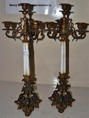 Lot 271 - A pair of French gilt metal and glass candlesticks