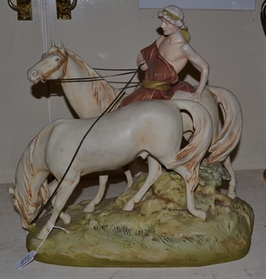 Lot 272 - A large Royal Dux group modelled as a figure on a horse with another horse