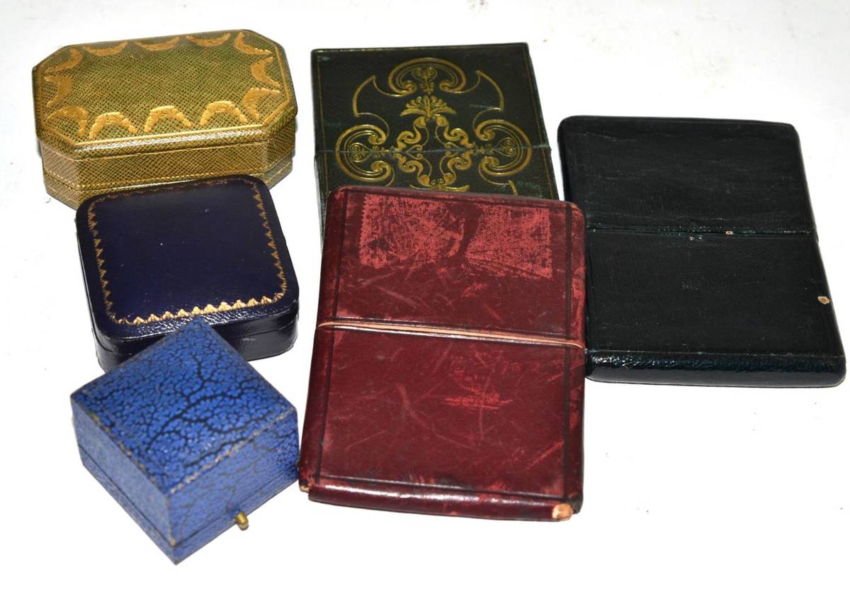 Lot 294 - A Cartier tooled gilt leather jewellery box together with three leather card cases and two...