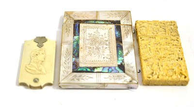 Lot 310 - A 19th century ivory card case, a mother of pearl card case and a game marker