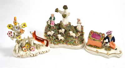Lot 322 - Three 19th century Staffordshire models including boy with dog and girl and boy with sheep