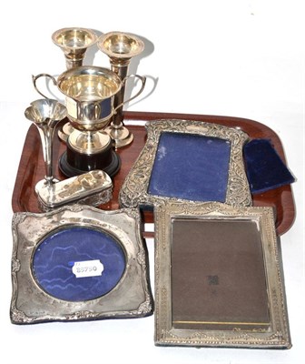 Lot 331 - Group of silver including three photograph frames, trophy, three bud vases and a silver topped...