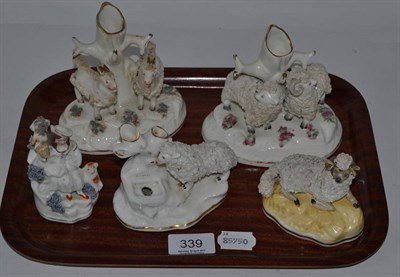 Lot 339 - Group of five Staffordshire models including three sheep form spill vases