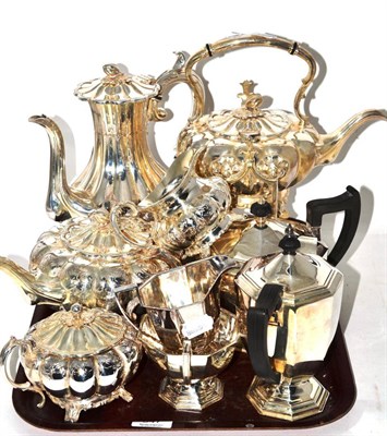 Lot 347 - A silver plated five piece tea service and a four piece example
