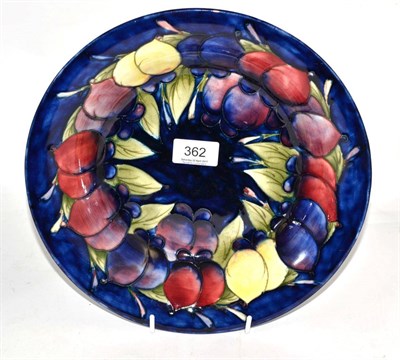Lot 362 - A William Moorcroft Wisteria pattern bowl, impressed factory mark, blue painted signature