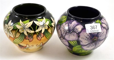Lot 367 - Two modern Moorcroft vases, 'Petunia' and 'Scrambling Lily' pattern, both 11cm high (boxed)