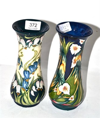 Lot 372 - Two modern Moorcroft vases, 'Elfin Beck' and 'Combermere' pattern, each 21cm high (boxed) (2)