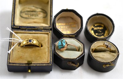 Lot 405 - A diamond two stone twist ring, 0.20ct approximately, a turquoise set ring and a sapphire set ring