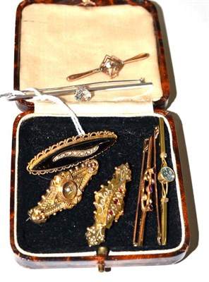 Lot 408 - A zircon bar brooch, an aquamarine bar brooch, stamped '15ct' and five other brooches (7)