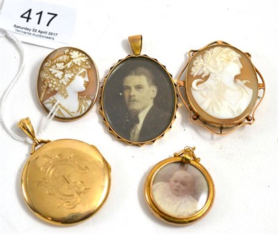 Lot 417 - A 9ct gold circular locket (engraved), a 9ct gold portrait locket pendant, another portrait pendant