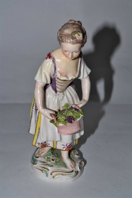 Lot 429 - Derby porcelain figure of a girl with flowers, circa 1770