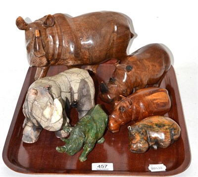 Lot 457 - A group of carved wooden, soapstone and pottery rhinoceros and hippopotamus models