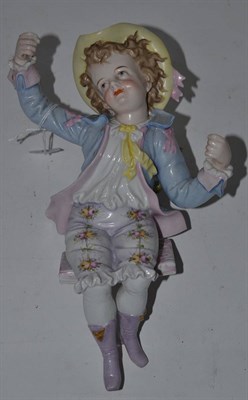 Lot 470 - Decorative French figure of a seated boy with hat on a swing