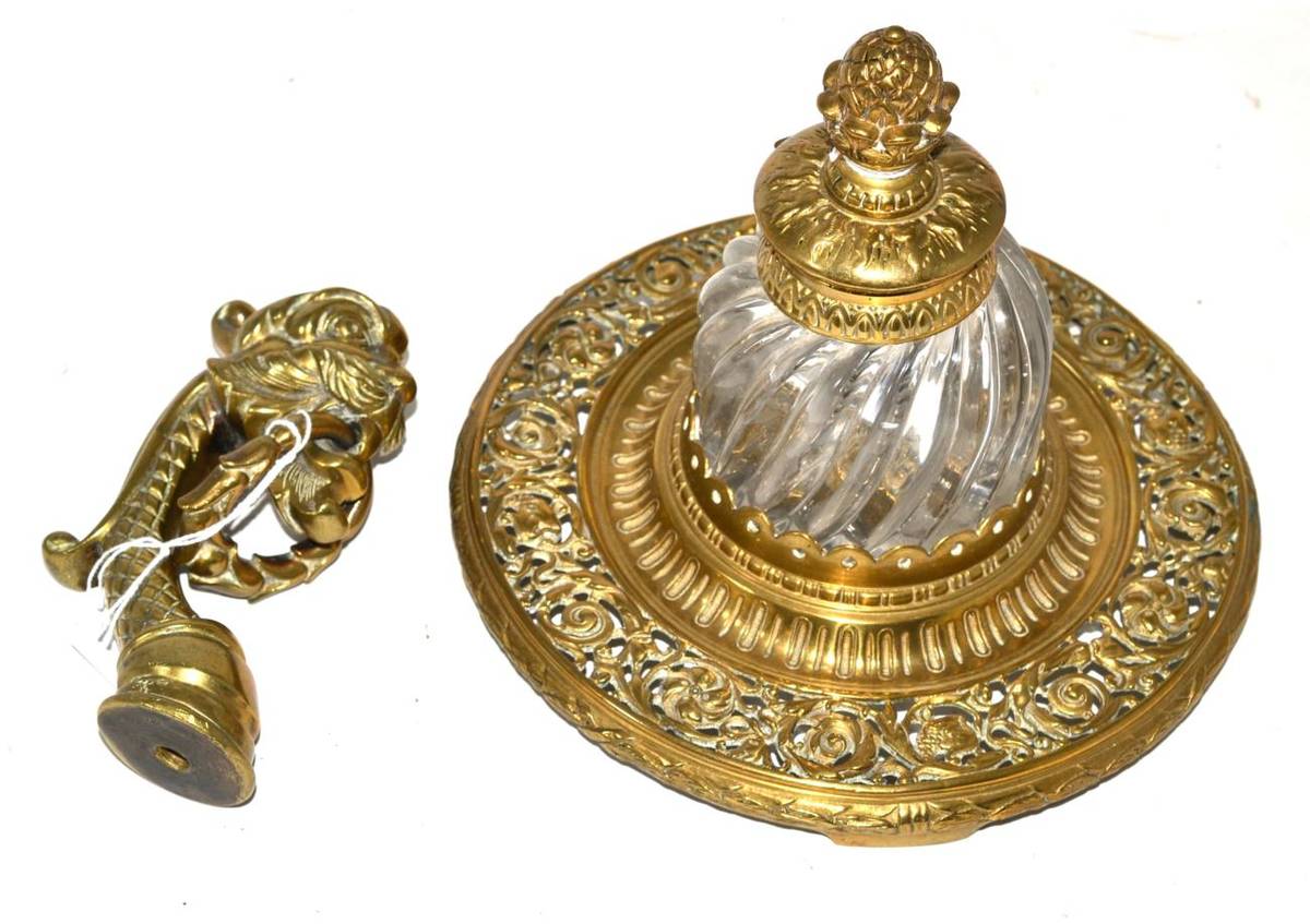 Lot 471 - A late 19th century pierced brass inkwell with glass inkwell and a stylish gondola mount (2)