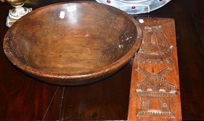 Lot 499 - A large turned wood butter bowl and a gingerbread mould