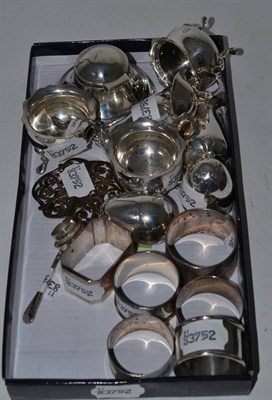 Lot 507 - A quantity of silver including peppers, six napkin rings, belt buckle, salt and pepper, inkwell etc