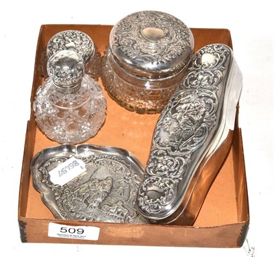 Lot 509 - A silver dressing table box, three silver mounted glass bottles and tray