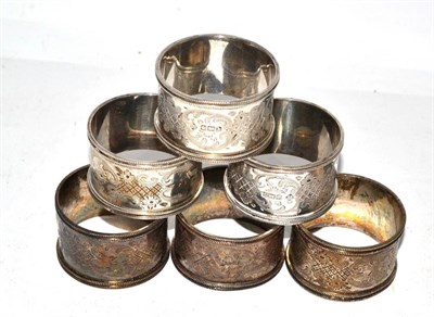 Lot 513 - A set of six silver numbered napkin rings