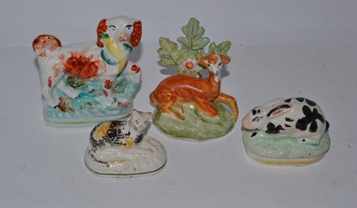 Lot 518 - Four 19th century Staffordshire models including rabbit, cat etc