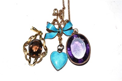 Lot 536 - A 9 carat gold smokey quartz pendant, a purple paste set pendant on chain and a blue enamel...