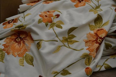 Lot 1004 - A pair of peach floral embroidered curtains on white linen ground