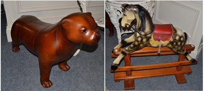 Lot 1068 - A Leeway carved wood rocking horse on trestle base and a leather dog stool (2)