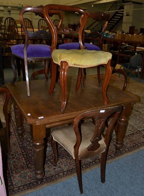 Lot 1070 - An extending dining table and nine chairs