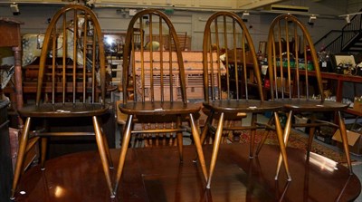 Lot 1076 - A set of four Ercol stick back chairs (4)