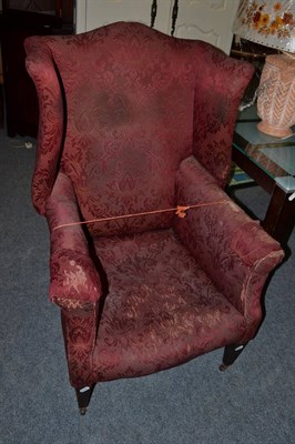 Lot 1085 - A 19th century wing back chair (for restoration)